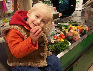 Kid in grocery checkout line